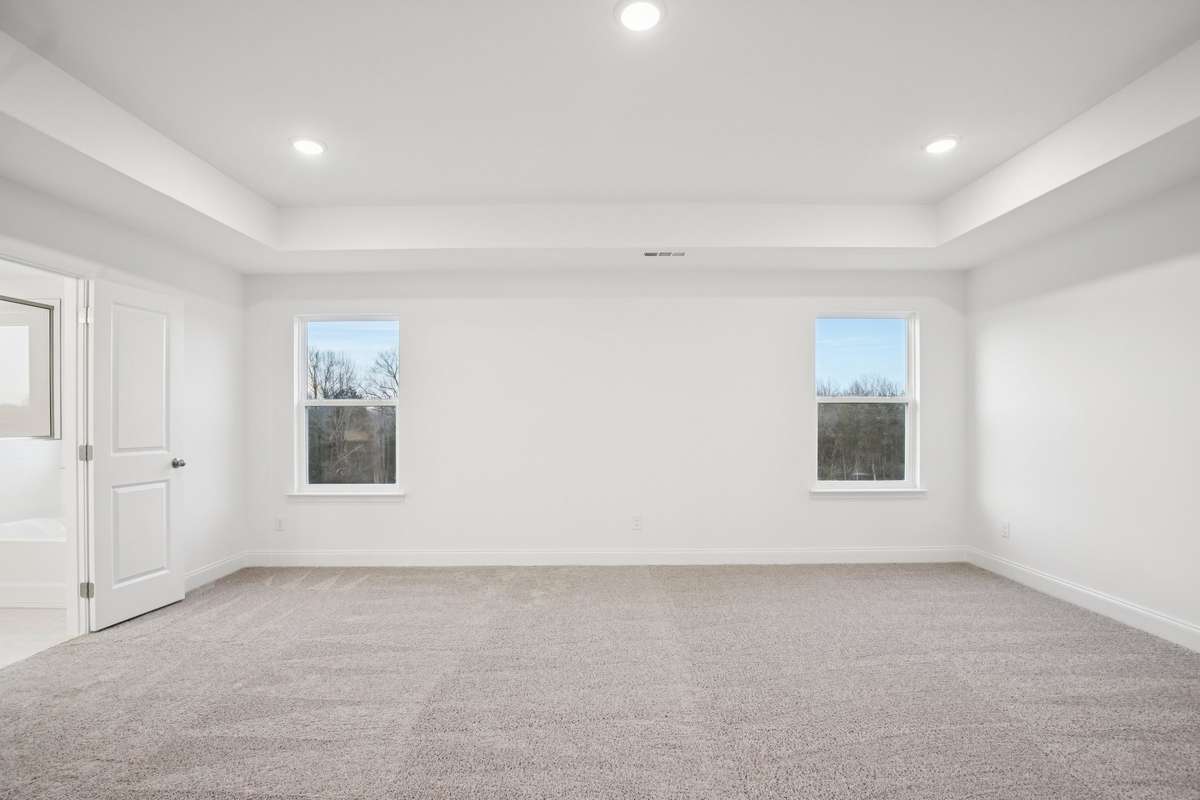 Backing up to green space, you will have amazing views from your Primary Bedroom windows.