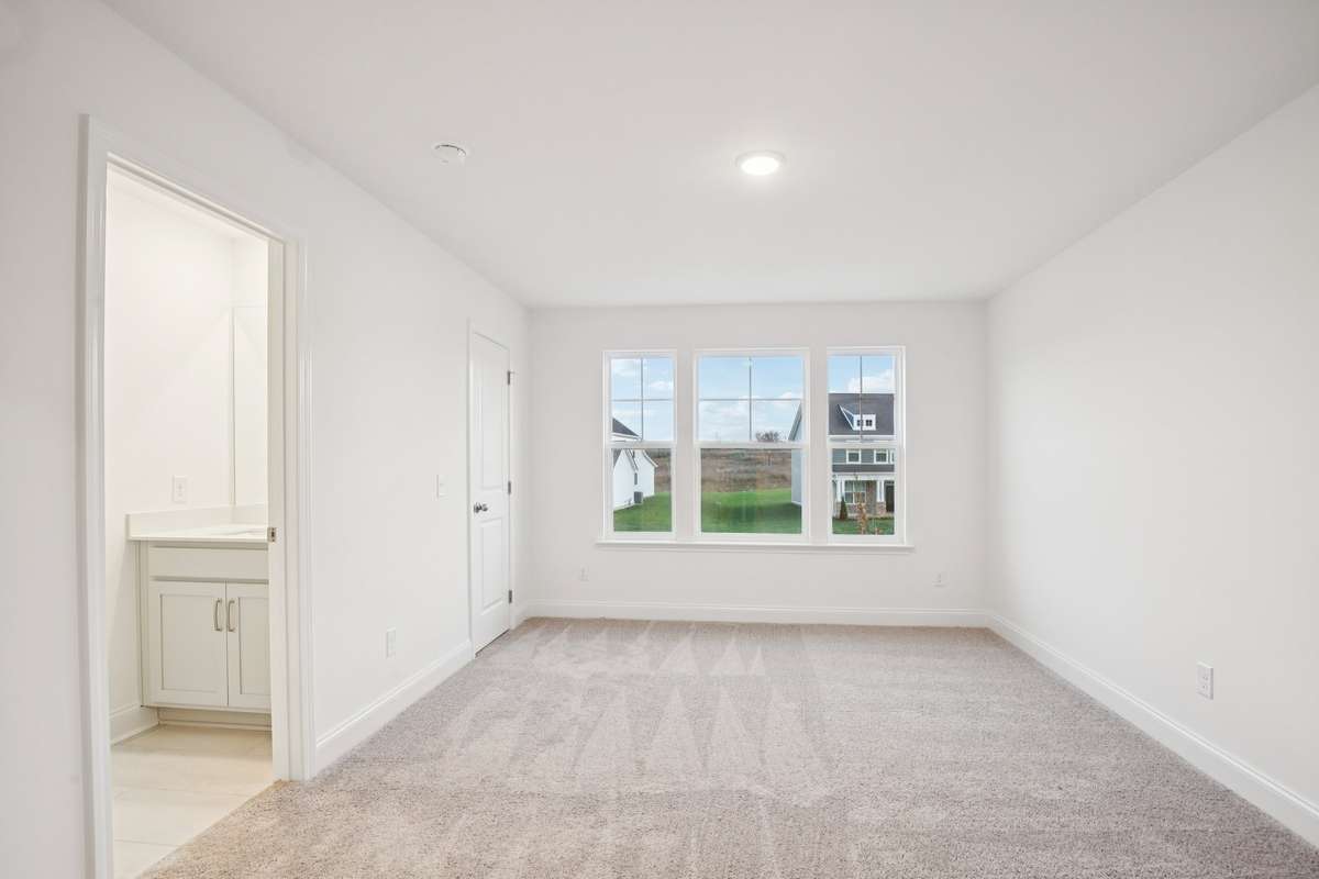Bedroom #4 shares a Jack and Jill bathroom with Bedroom #3, ensuring that each bedroom has its own personal vanity space!