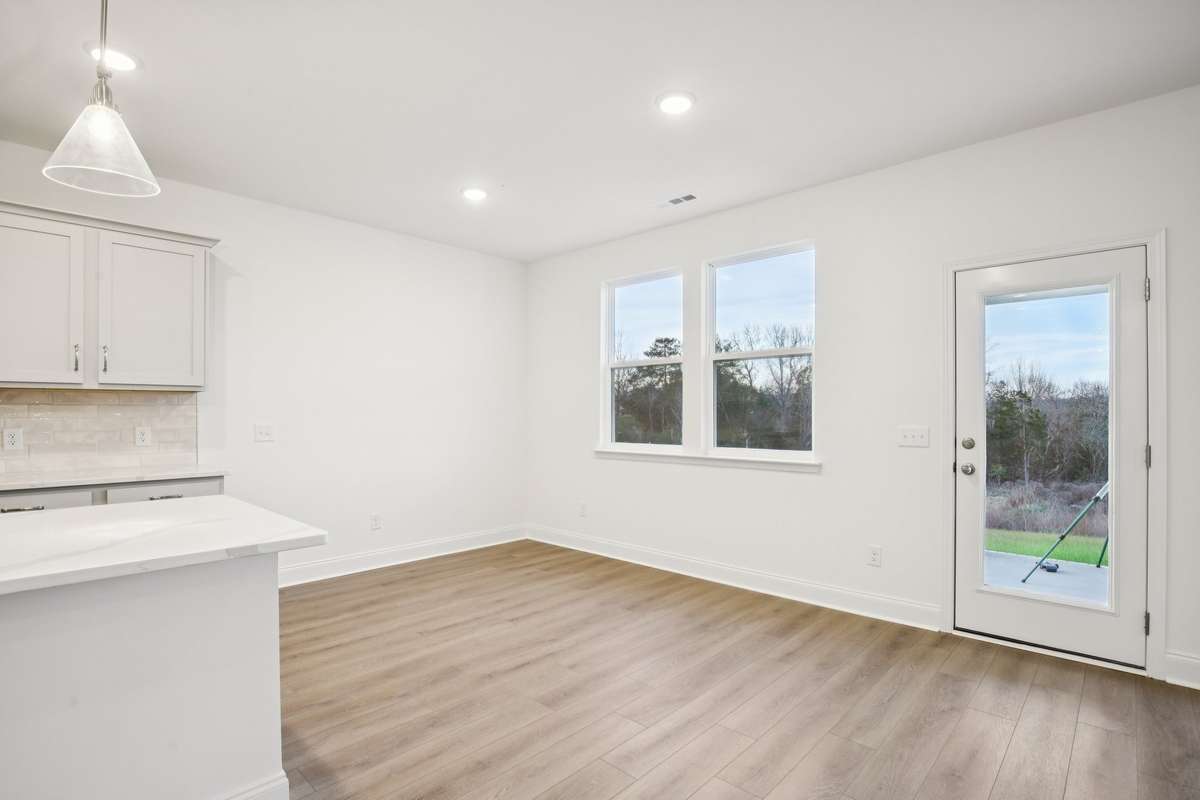A covered rear patio is located right off of the space as well, allowing indoor/outdoor entertaining with ease.