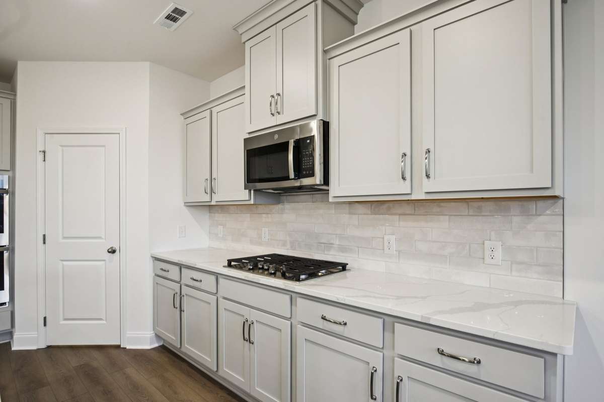 Stainless steel appliances have been included in your kitchen including a gas cooktop, double oven, microwave and dishwasher.