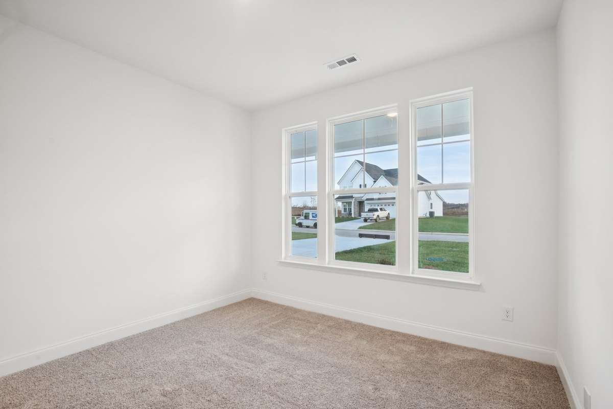 Your guest bedroom offers incredible versatility—use it as a home office, hobby room, or whatever fits your needs best.
