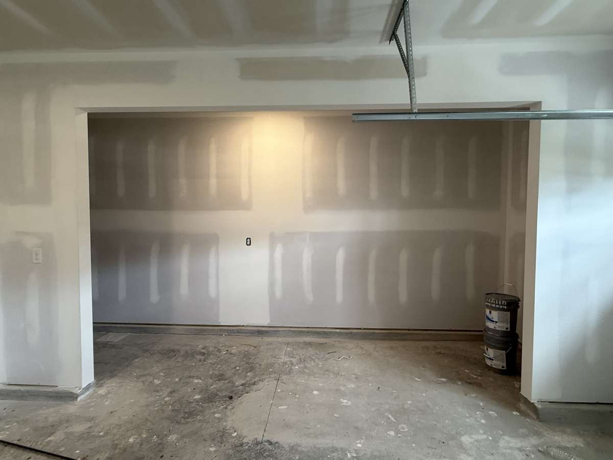 Your spacious garage includes a storage area with plenty of room for tools, outdoor gear, or seasonal items—keeping everything organized and within easy reach.