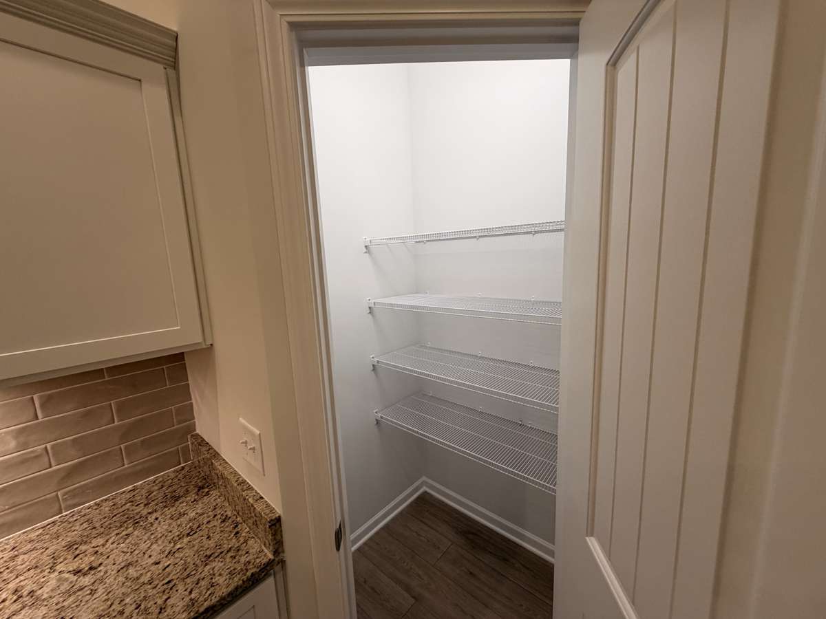 Stock Photo: Walk in corner pantry
