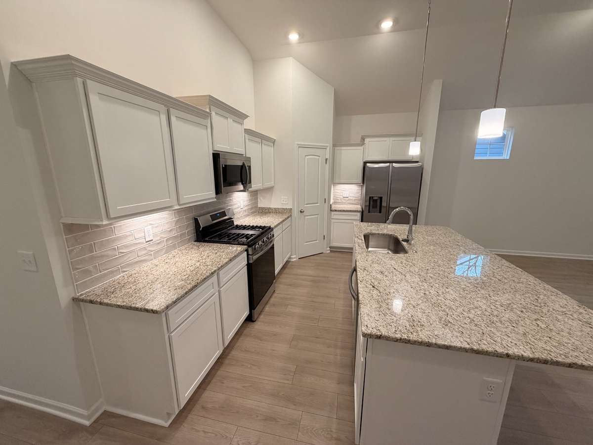Stock Photo: Home will have Backsplash and Quartz Countertops in the Kitchen
