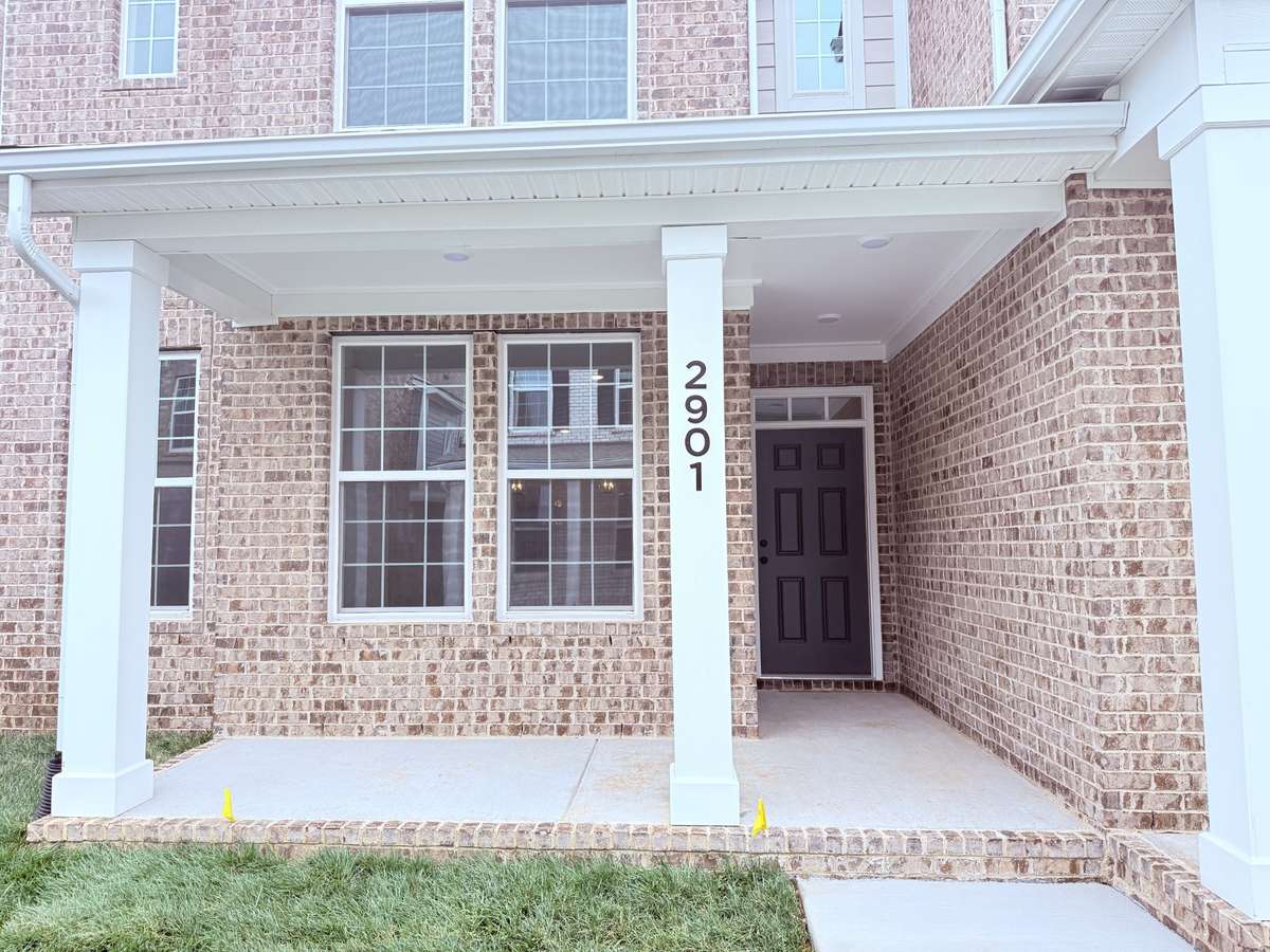 The covered front porch is the ideal spot to unwind—savor your morning coffee or get lost in a good book while enjoying the fresh air.