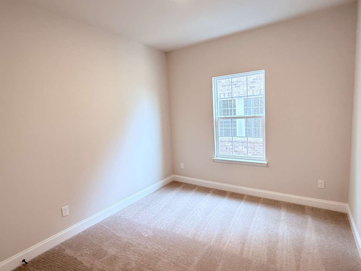 Bedroom 2 is conveniently located upstairs, offering privacy and easy access to shared bathrooms.