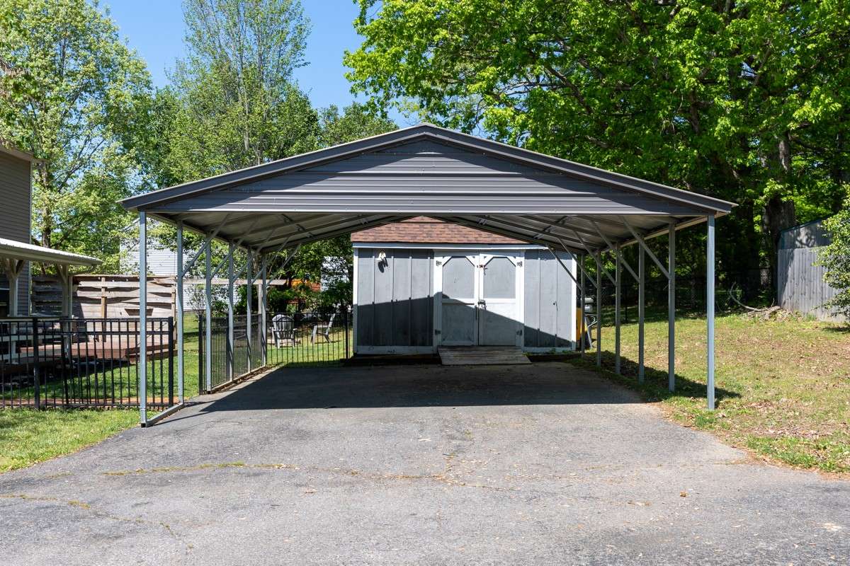 Detached 2 car garage and storage building.  Enjoy lighting and power in the shed.
