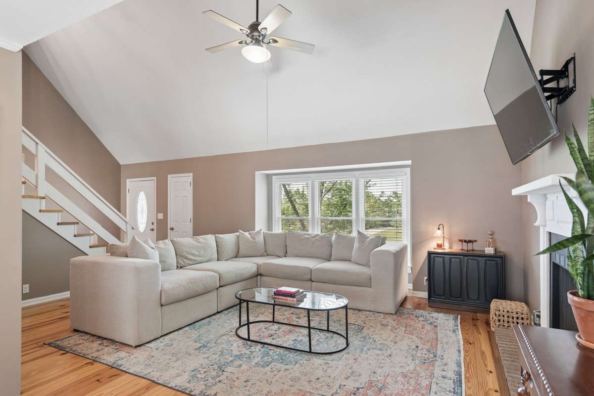Open floor plan with tons of natural light.  Note the hardwood flooring and neutral paint that makes it move-in ready.