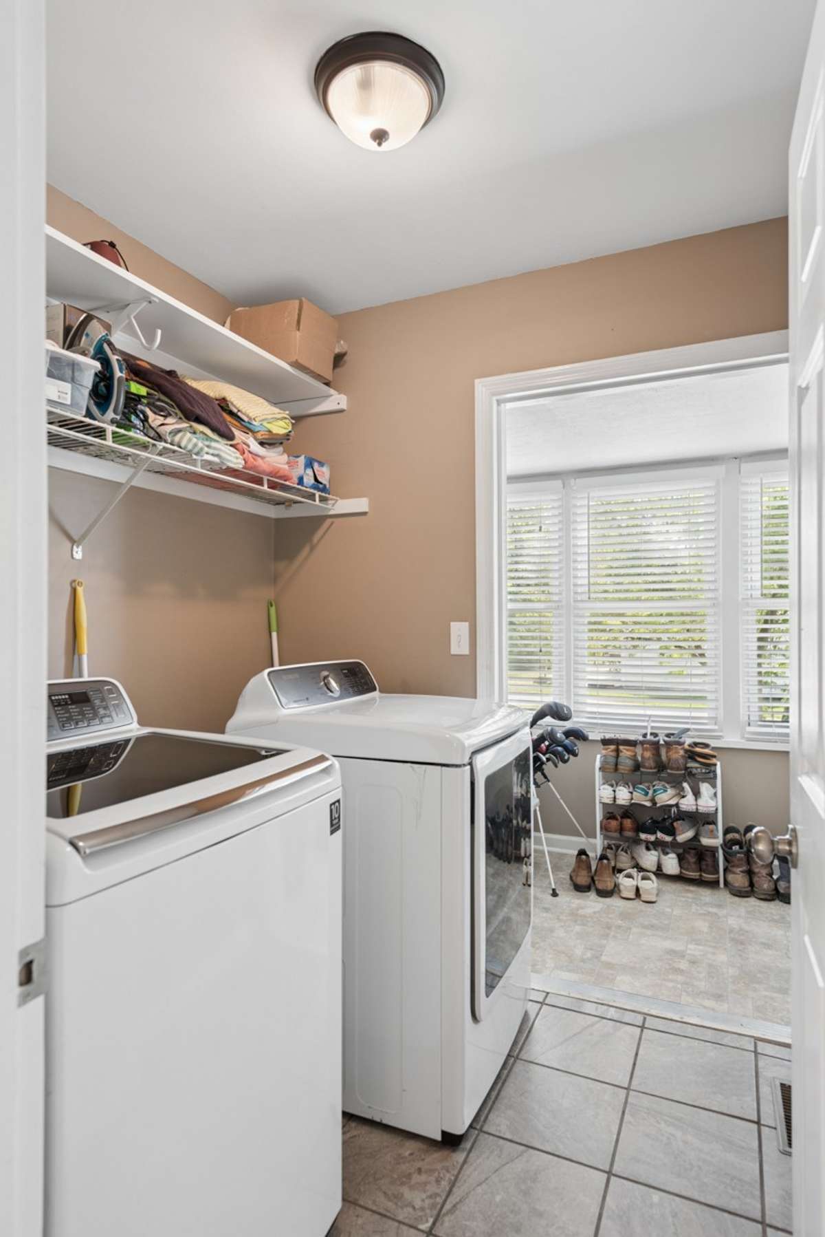 The oversized, tiled laundry is on the main floor, just off of the kitchen.