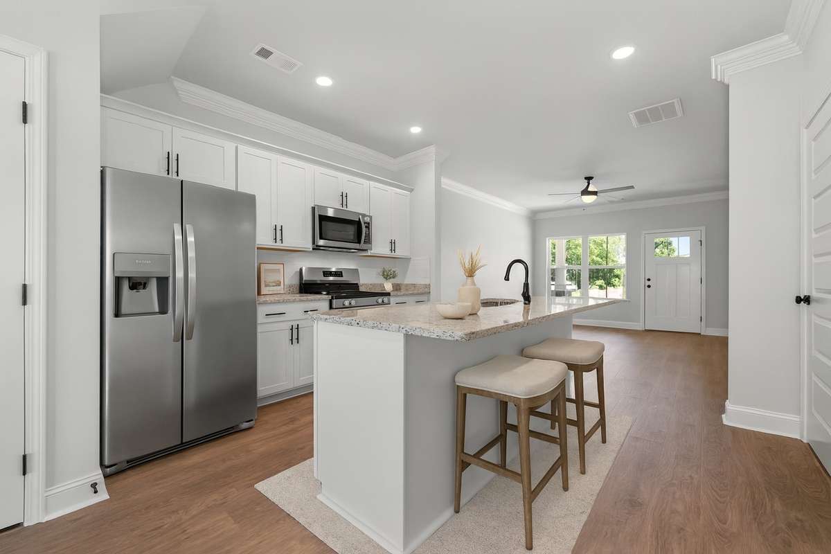Pic is virtually staged image of previously completed home of same floorplan. Features and finishes may vary. Refrigerator not included.