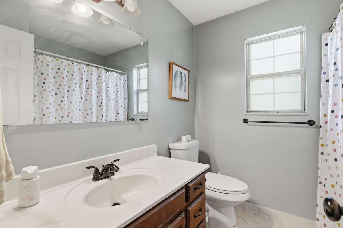 Bathroom two with tub/shower combo.