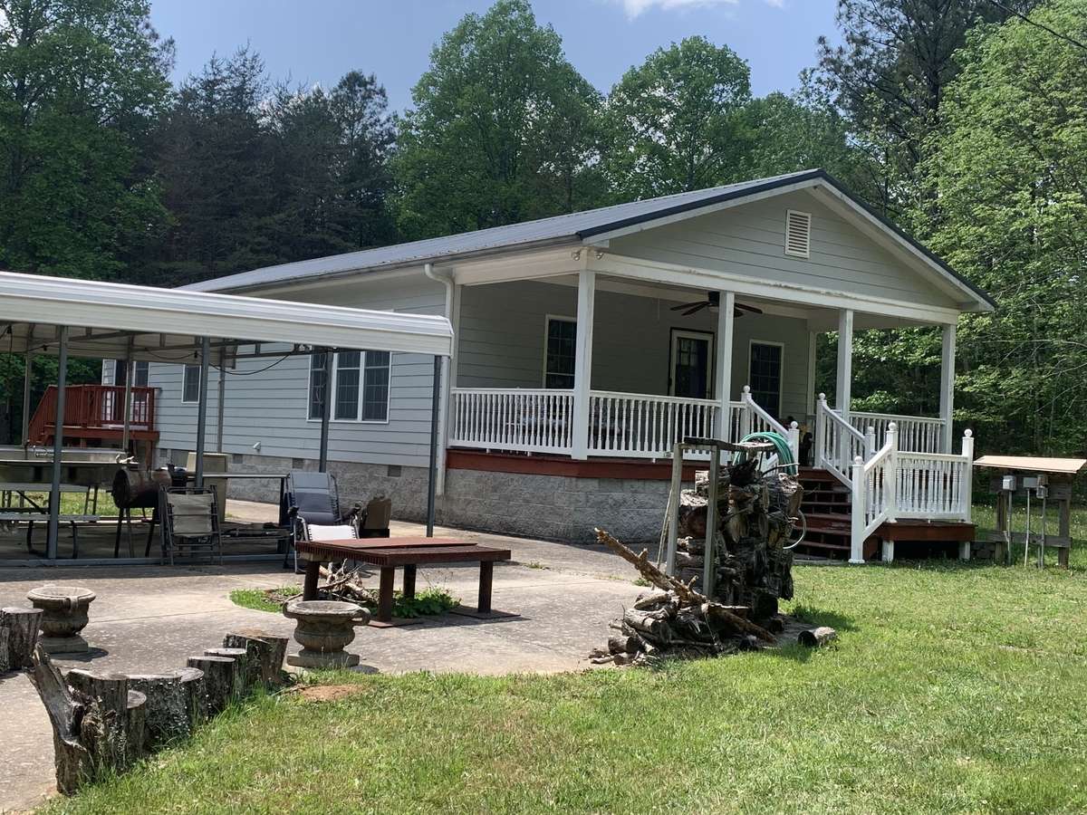 Carport to left.  Outside fire pit.