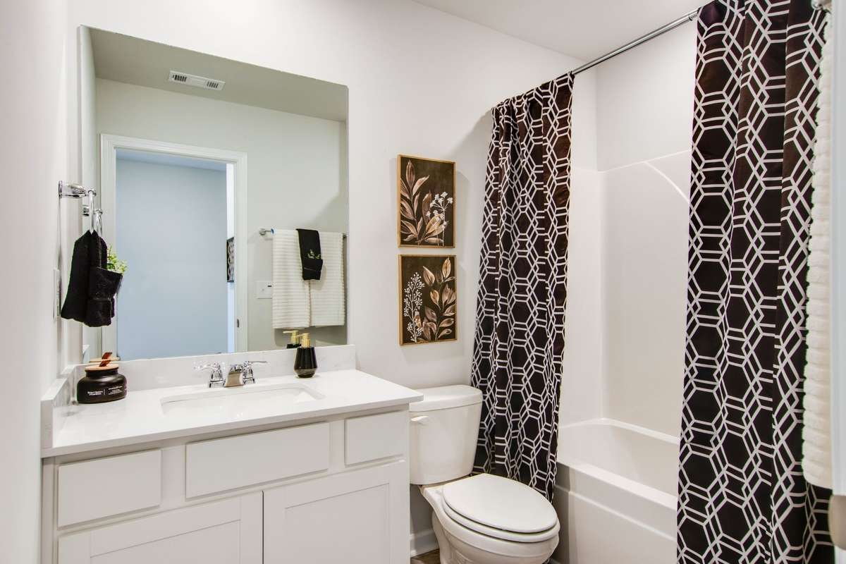 Secondary Full bath with Quartz counter tops.