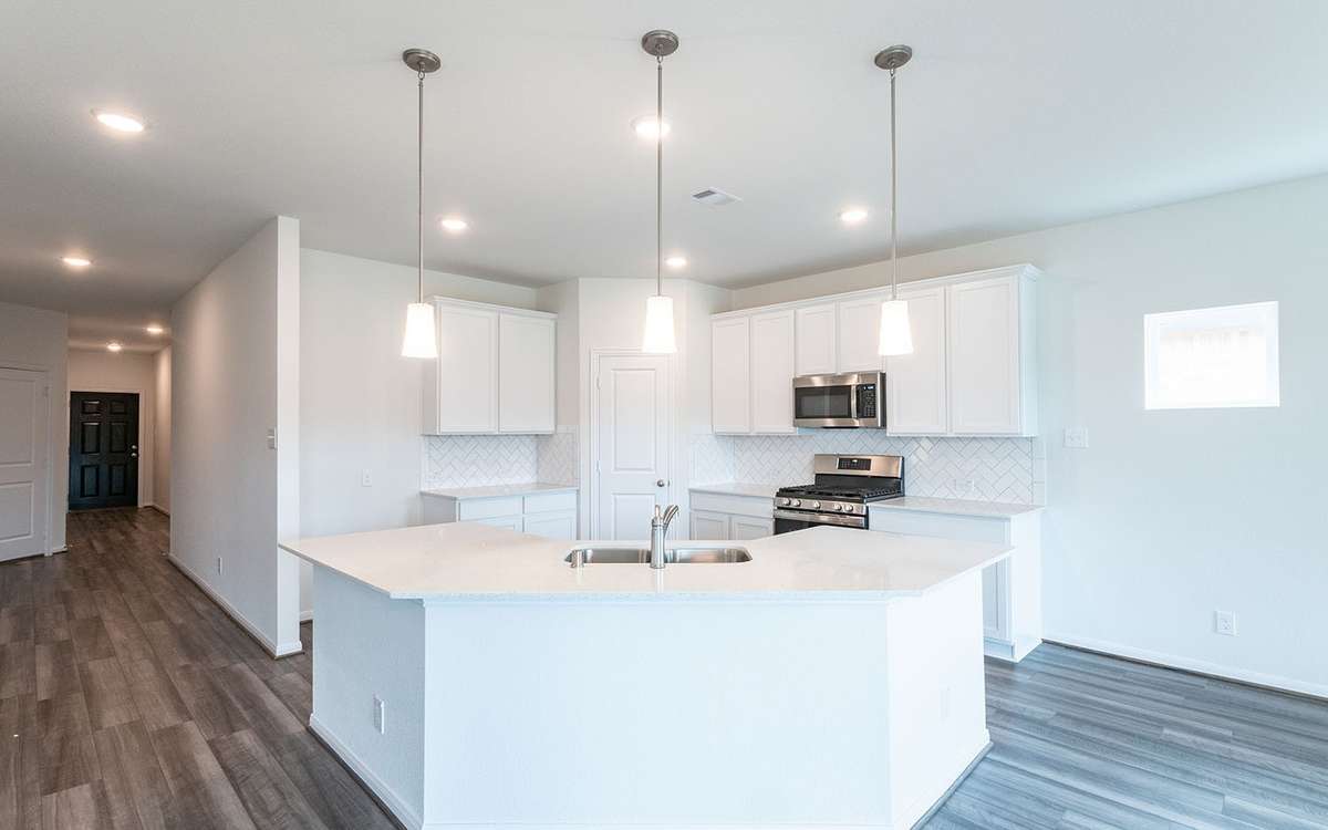 Picture are of a previously completed home and finishes will vary. This home includes 3 garage garage.
