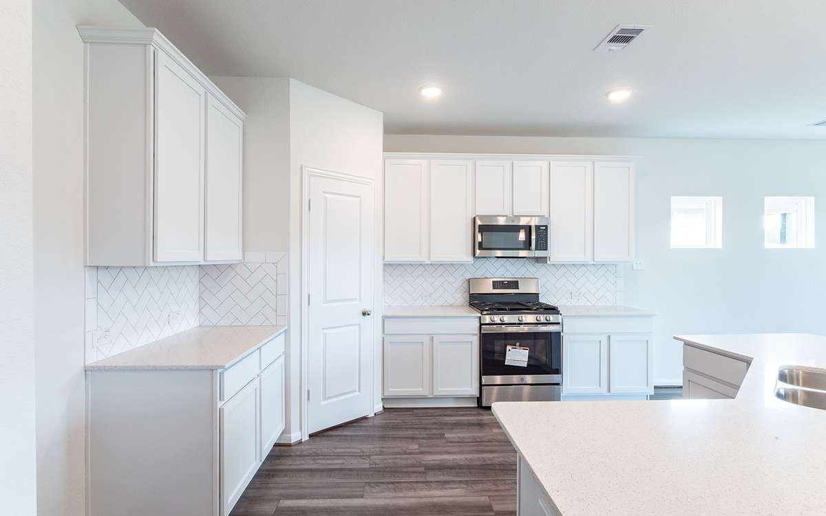 Picture are of a previously completed home and finishes will vary. This home includes 3 garage garage.