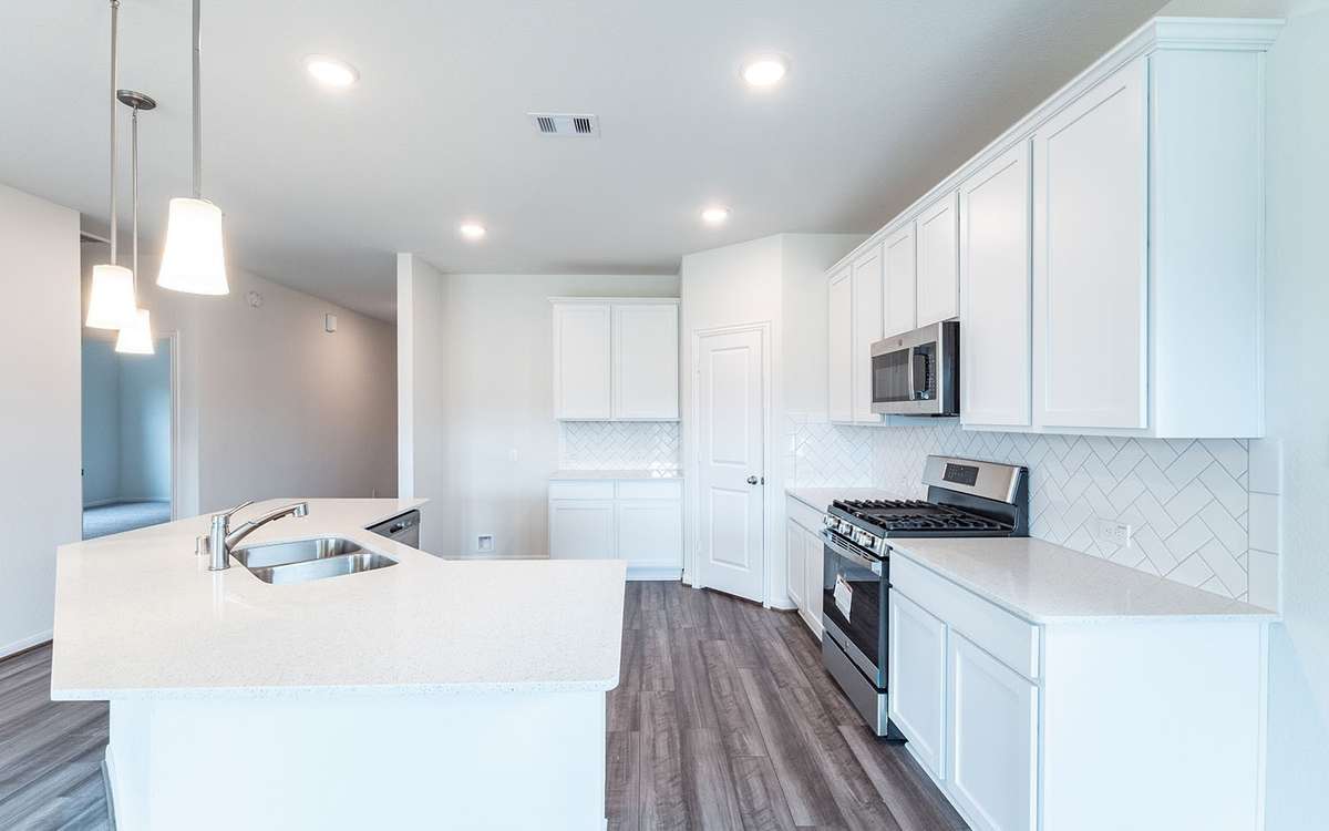 Picture are of a previously completed home and finishes will vary. This home includes 3 garage garage.