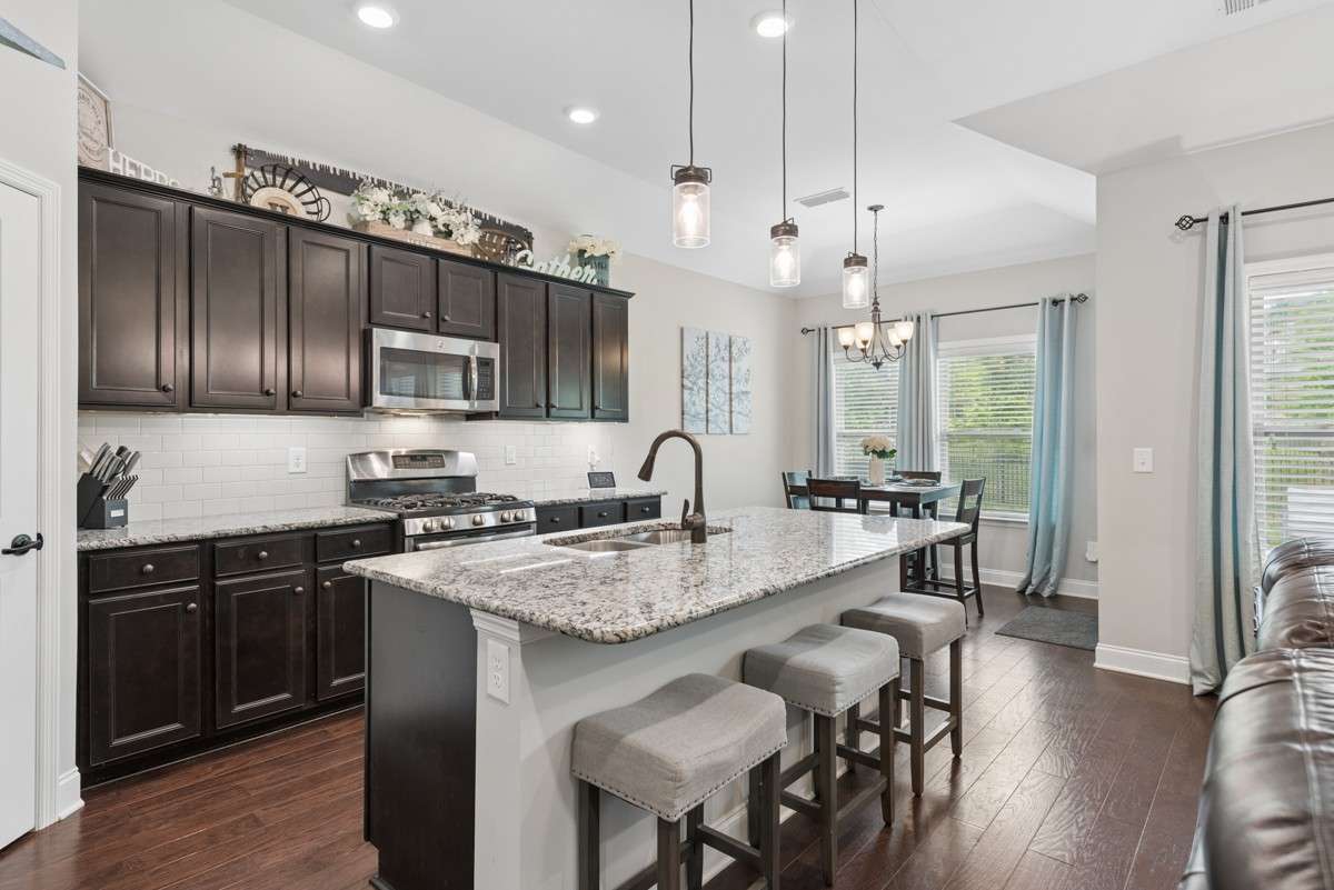 Granite counters, lots of cabinets and stainless-steel appliances make this both a beautiful and functional kitchen.
