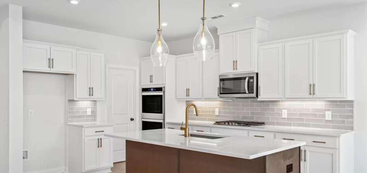 NOT ACTUAL HOME. Picture of same plan in another community. Home showing optional upgrades and features.