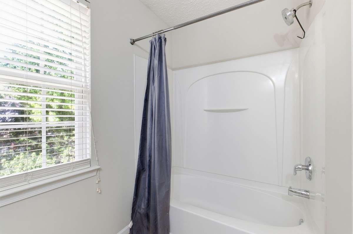 Secondary bedroom showing ample double-door closet space