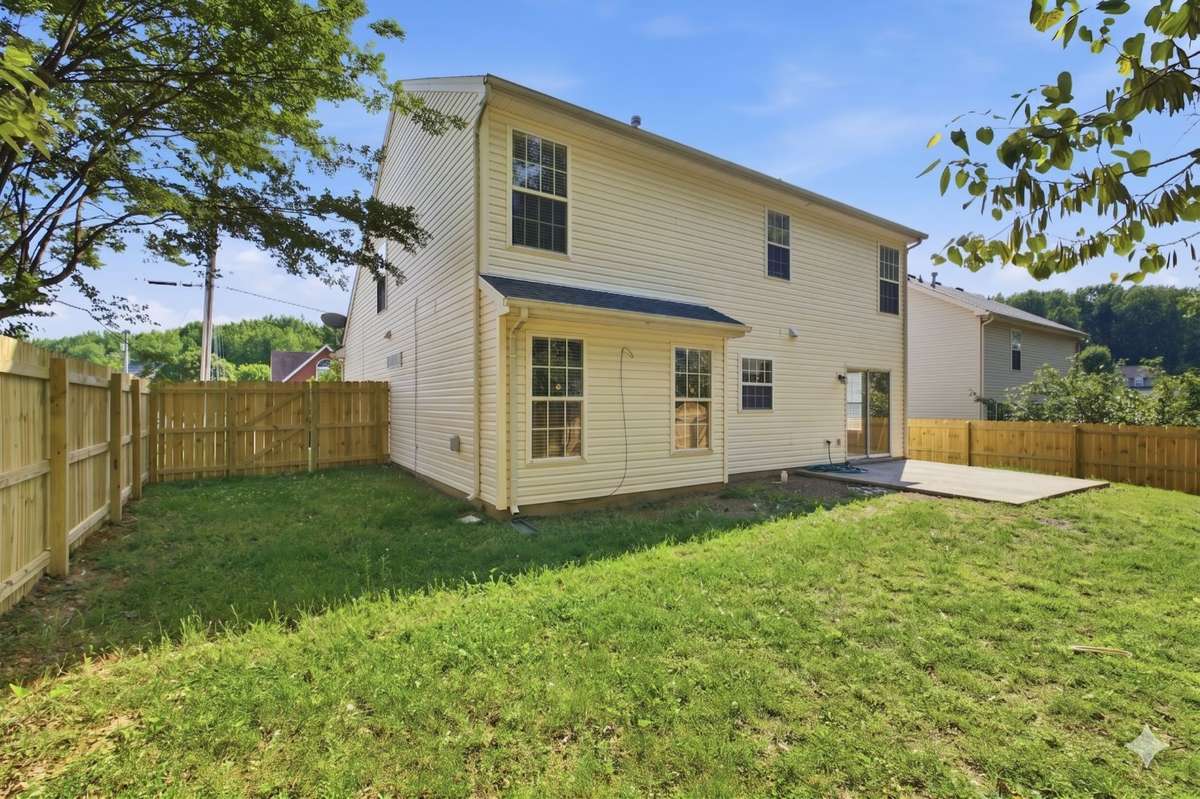 Rear exterior of the home showcasing the back patio, perfect for outdoor entertaining