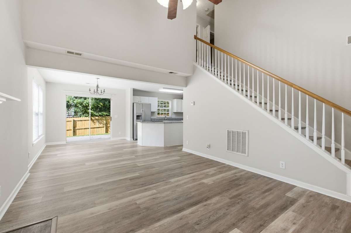 Open-concept layout providing a perfect view from the living room into the kitchen and dining areas