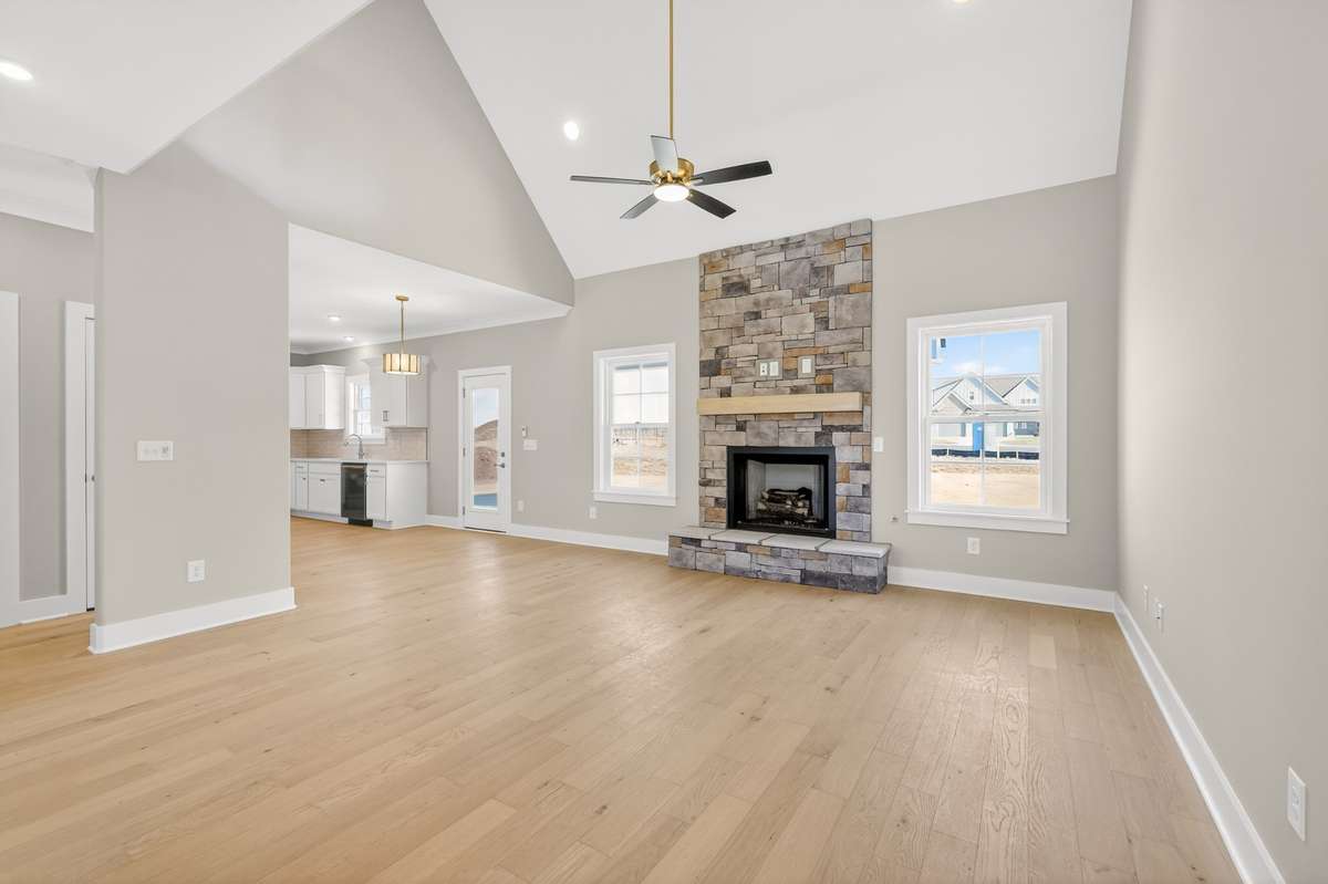 Living room with vaulted ceilings and gas fireplace