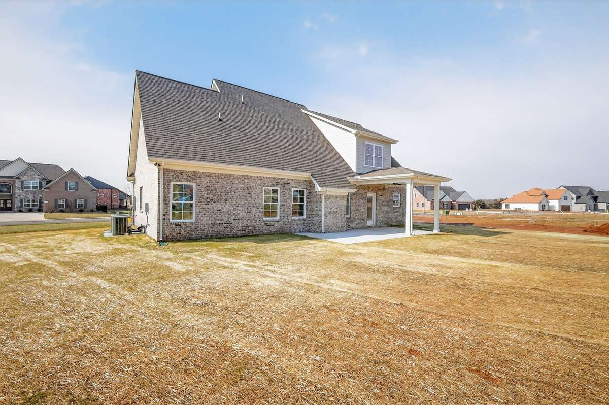 Large backyard with covered patio