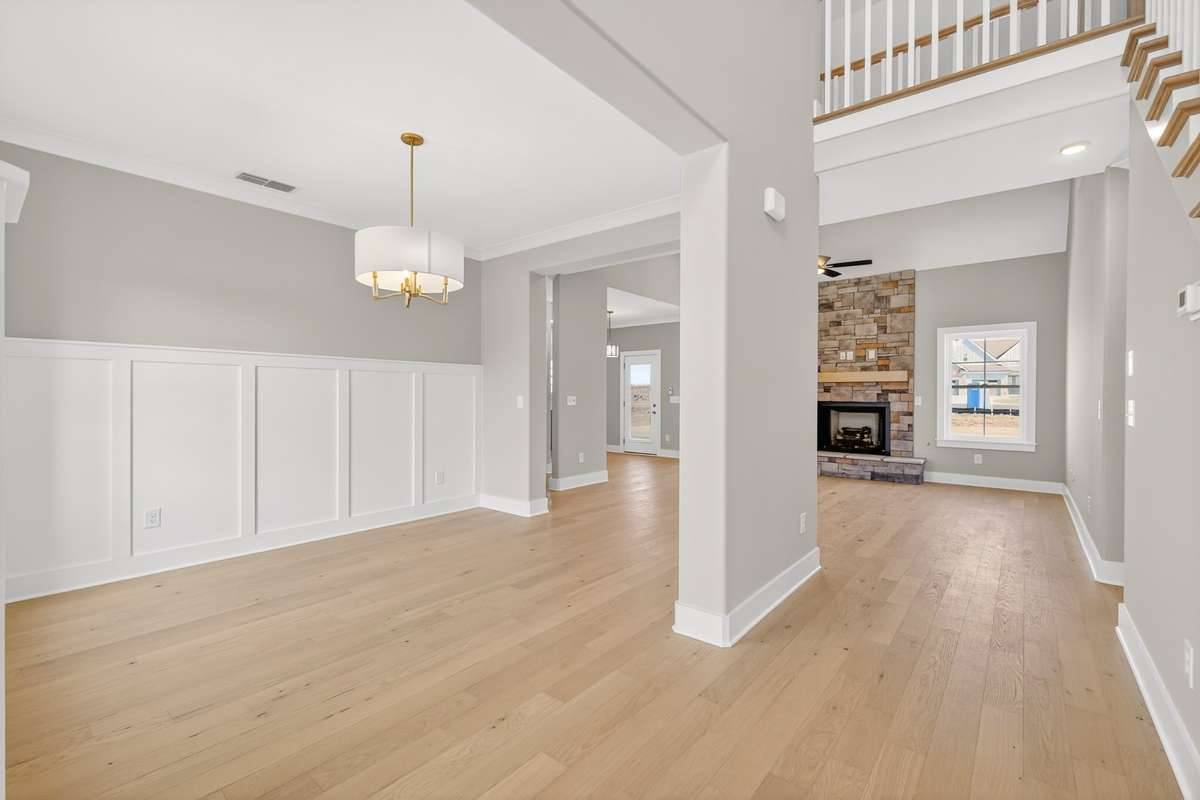 Dining room opens into living room with gas fireplace