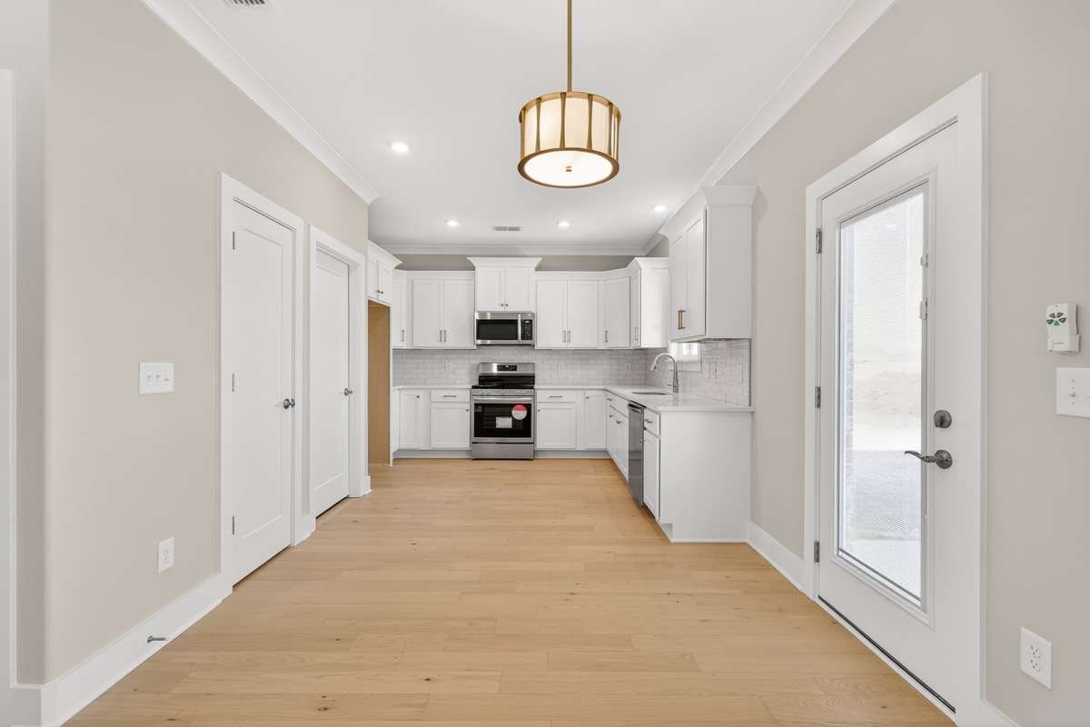 Kitchen with stainless steel appliances and quartz countertops