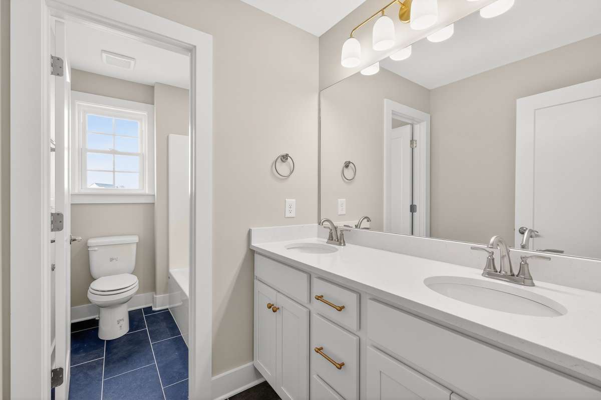 Upstairs bathroom with double vanities