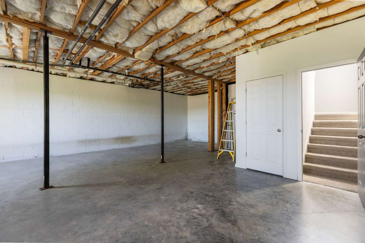 Unfinished basement space. Lots of room for expansion!
