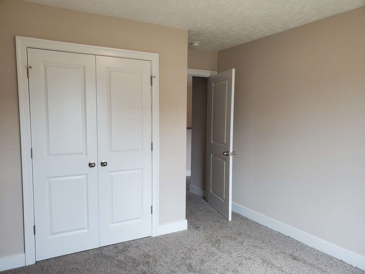 Second Bedroom Upstairs with Double Door Closet.  Picture of Similar House.