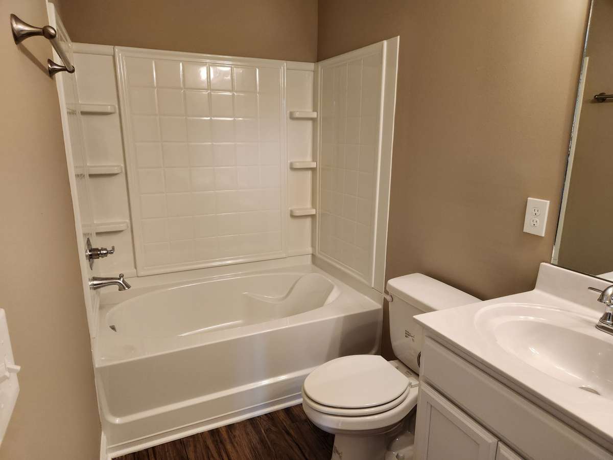 Large Garden Tub and Shower in Primary Bathroom. 
Previous House is pictured.