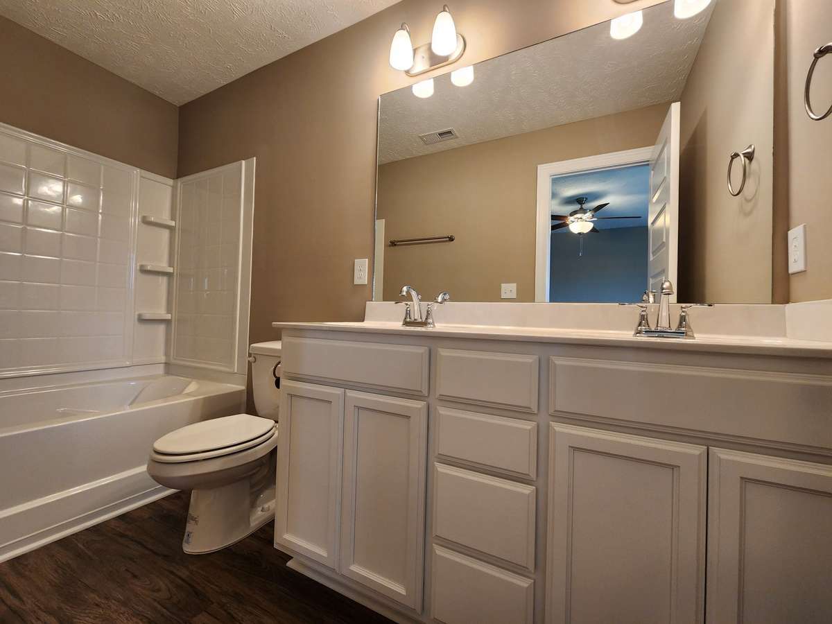 Primary Bedroom has Custom Cabinet and 2 Sinks. 
Picture of Previous House.
