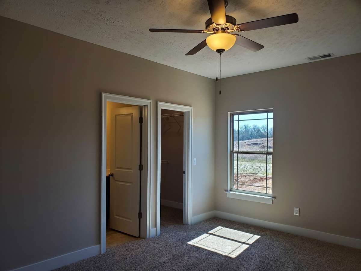 Owner's Suite on Main Level with Walk-In Closet. 
Picture of Previous House.