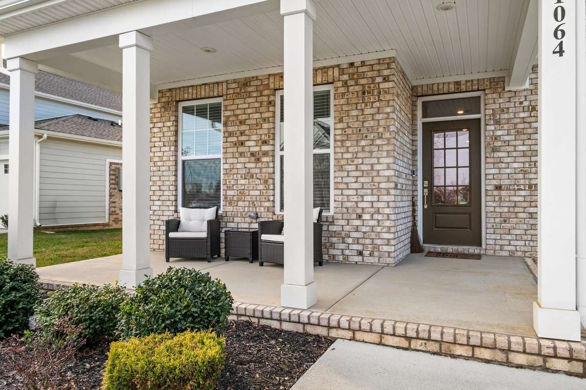 Front porch is a great place to relax and say hi to the neighbors on their strolls.