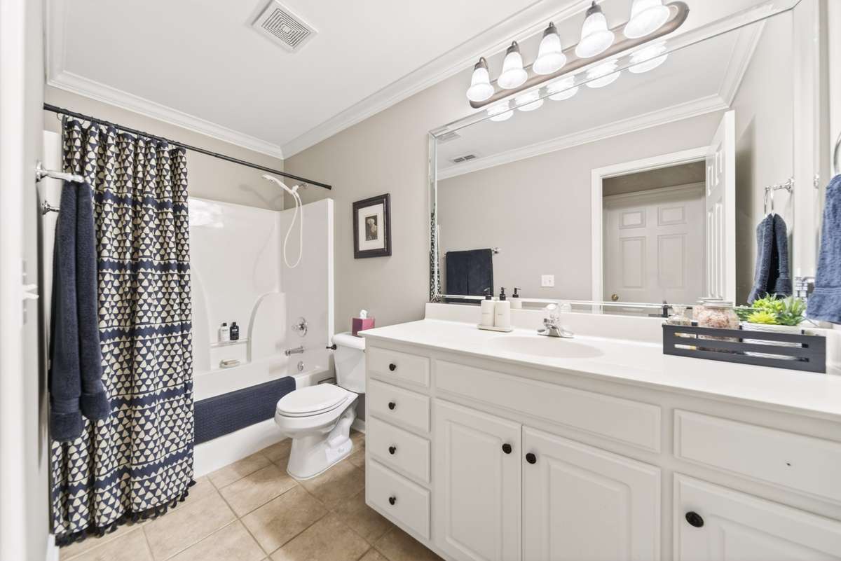 Full bathroom downstairs next to 3rd bedroom/guestroom/office.