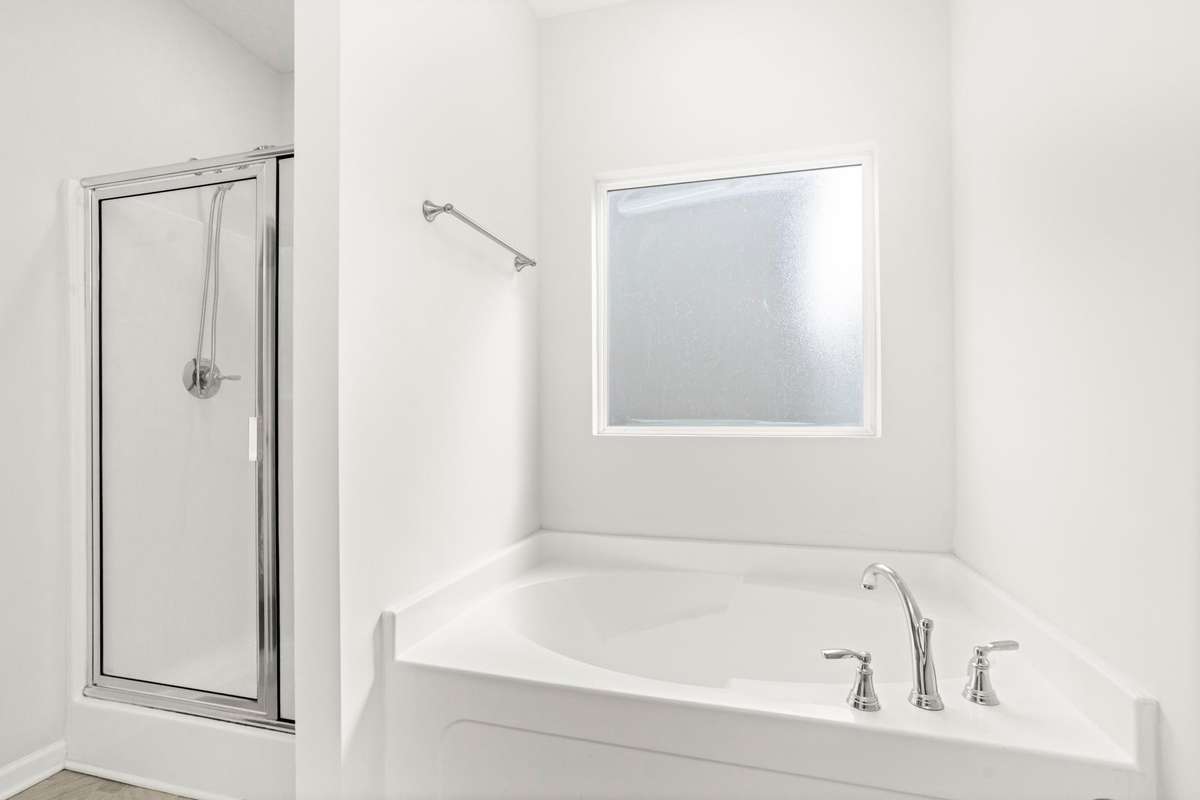 Separate shower and tub in primary bathroom