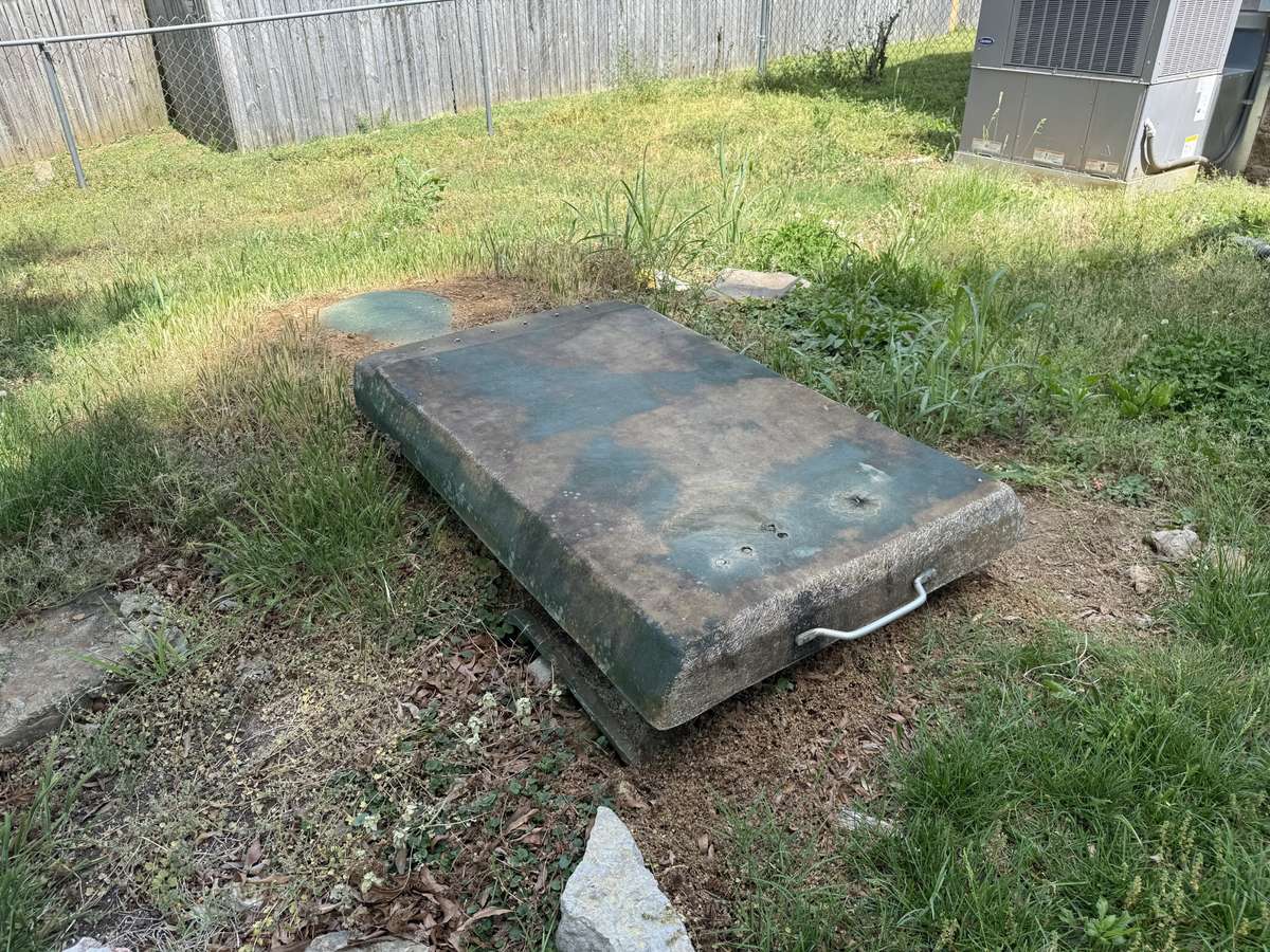 Storm shelter in back yard.