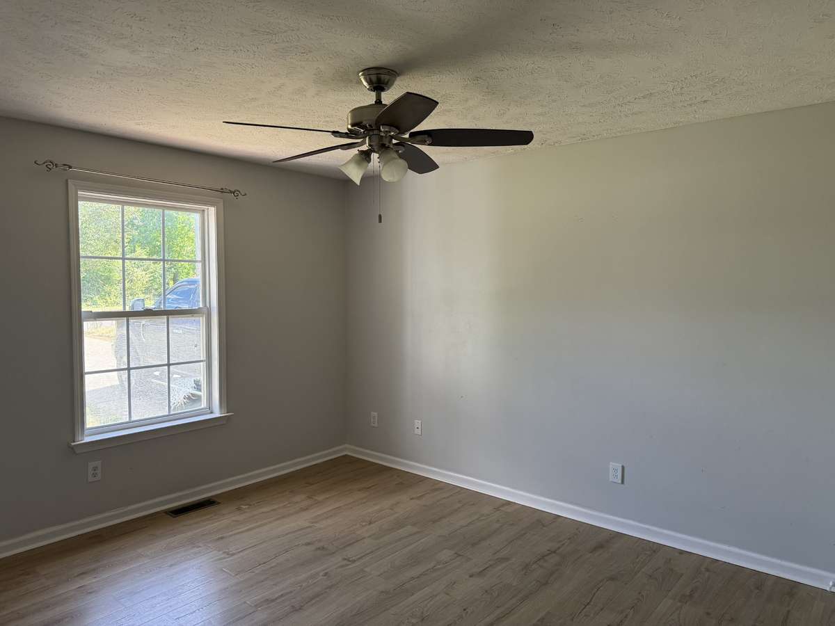 Primary bedroom located in front, driveway side of the home.