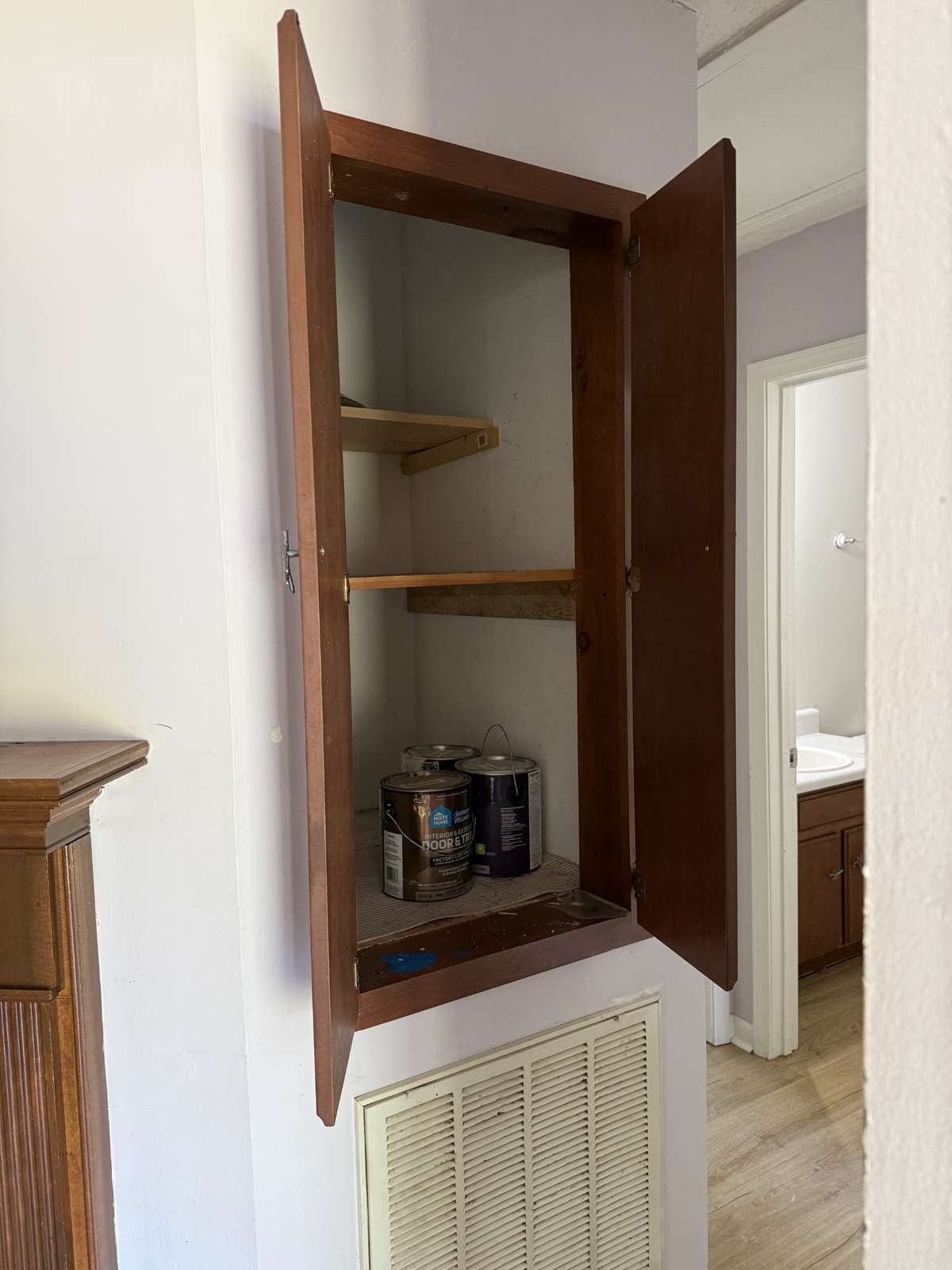 Extra shelved space beside fireplace.