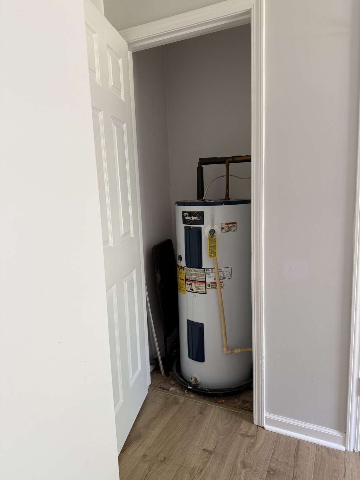Water heater closet located in third bedroom behind its own door for access.
