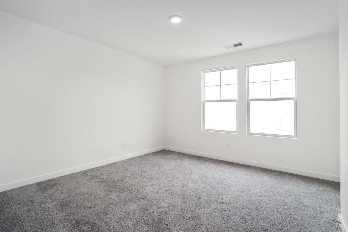 Picture of model home and not of actual home being built.  This loft is converted to a 4th bedroom!  Colors and selections may vary