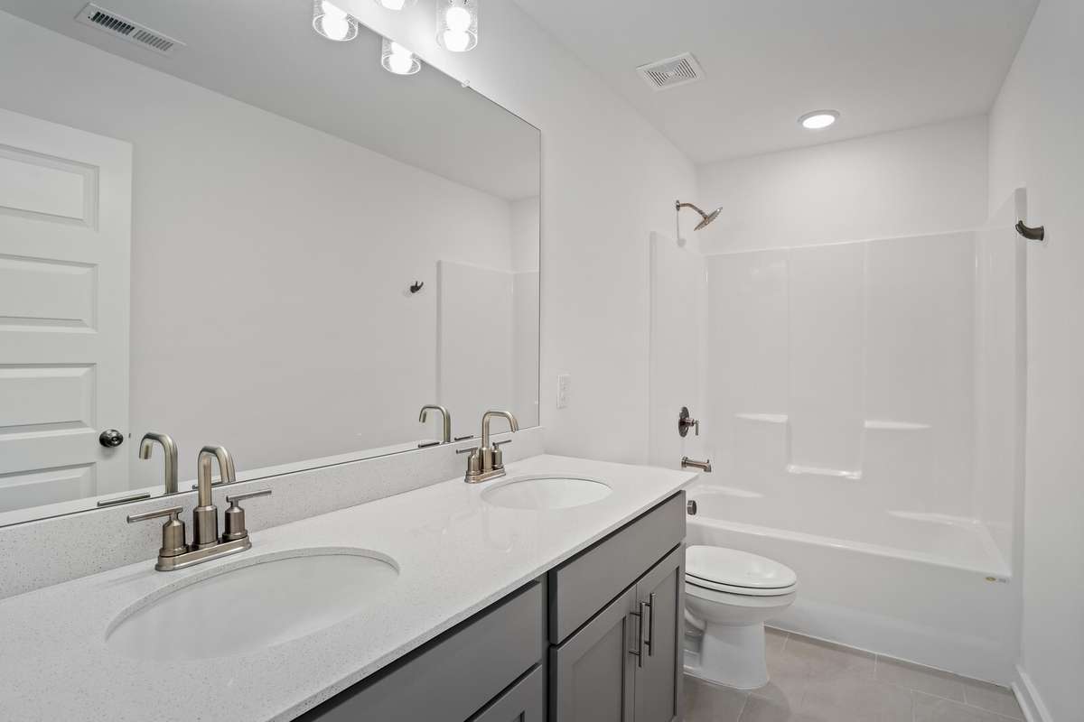 Picture of model home and not of actual home being built.  Colors and selections may vary