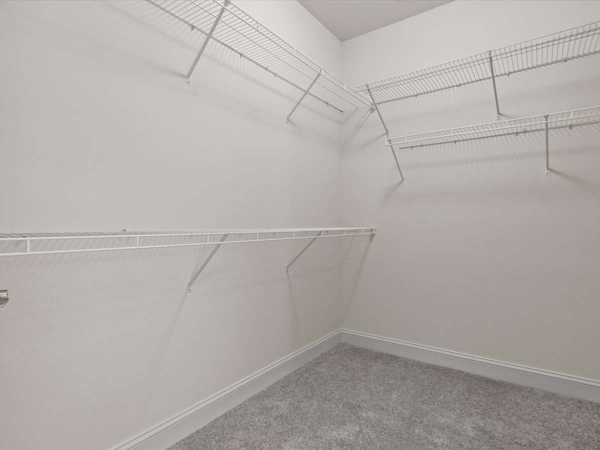 Primary Bathroom - tile flooring, vaulted ceiling, double vanities, walk in closet, skylight, separate whirlpool tub and shower
