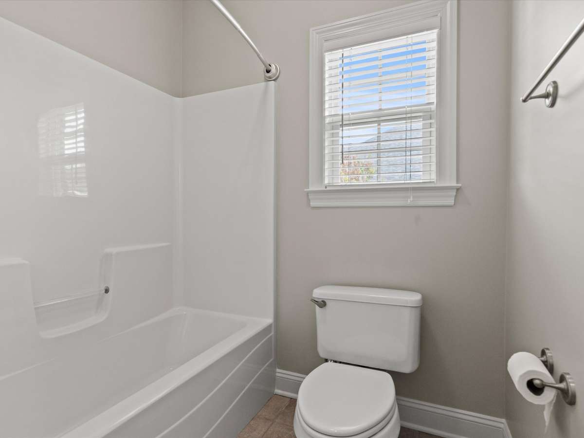 Full Bathroom- tile flooring, full bath, tub/shower combo