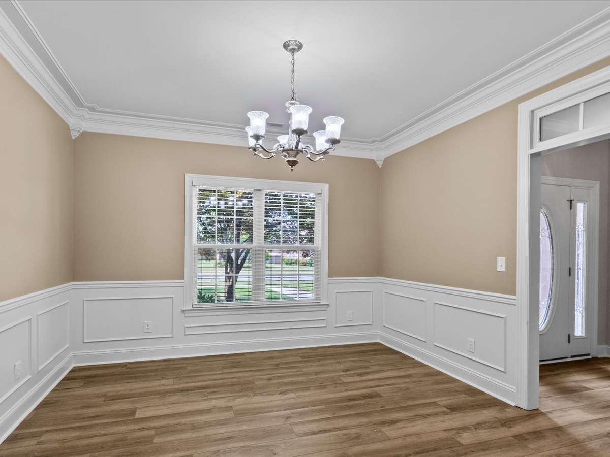 Dining Room - LVP flooring, wainscotting, crown molding, 9' ceiling