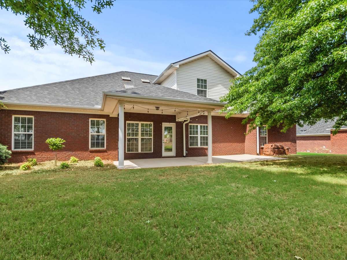 Back of house - Patio, covered patio with house entry, beautiful landscaping