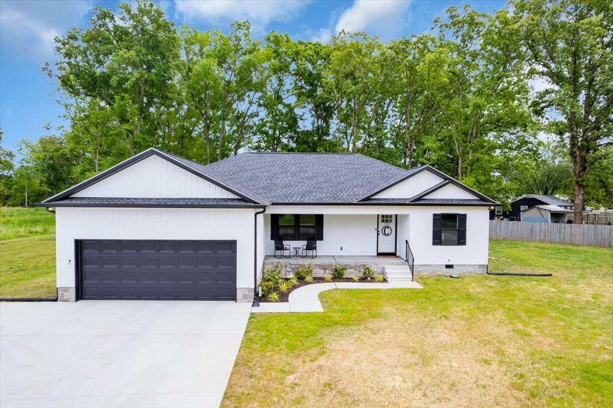 The beautifully landscaped yard enhances curb appeal and invites you inside.