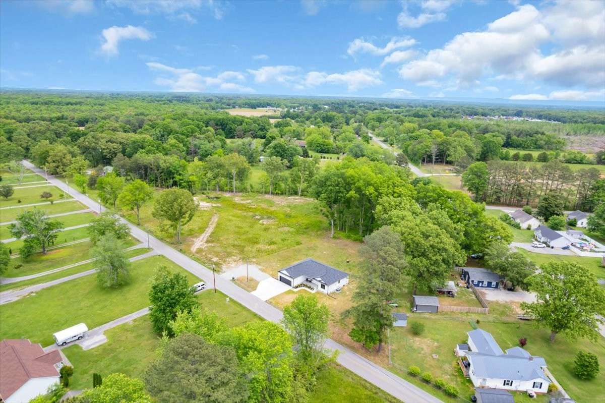This property provides the perfect backdrop for outdoor living, surrounded by mature trees and natural beauty.